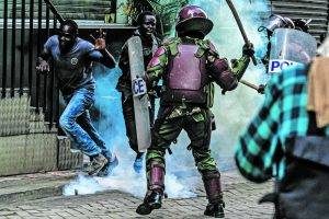 Police Officers Use Teargas And Clubs To Disperse