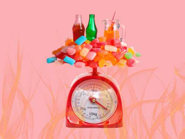 Kitchen scale graphic with sugary foods on top